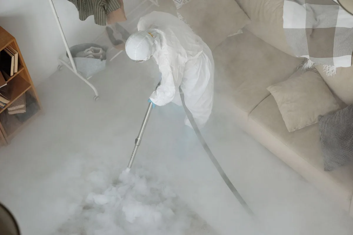 Biohazard cleanup technician in protective equipment, Springfield, MO